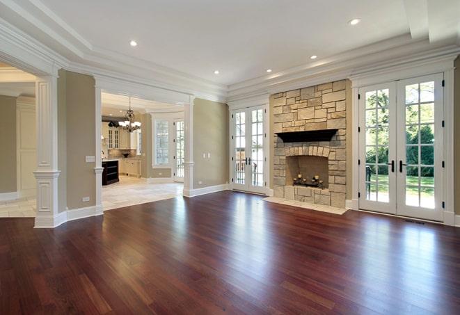 wide-angle shot of hardwood flooring in a spacious hallway